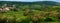 The landscape of the edge of the village, agricultural land, fields, groves of trees in the summer