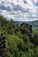 Landscape in the Elbsandstone mountains in Saxon Switzerland with forest and rock pillars