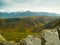 Landscape empty valley green hills white mountains