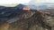 Landscape of erupting Mauna Loa Volcano in Hawaii with smoke and blue horizon sky