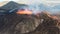 Landscape of erupting Mauna Loa Volcano in Hawaii with smoke and blue horizon sky