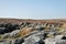 Landscape with the exposed stones at the top of a cairn known as the millers grave on midgley moor in calderdale west yorkshire