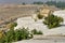 Landscape with famous terraces and ruins of Hierapolis city - Landmark attraction in Pamukkale, Turkey