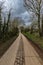 Landscape of farm fields and dirt road ideal for active recreation in Borgloon, Belgium