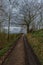 Landscape of farm fields and dirt road ideal for active recreation in Borgloon, Belgium