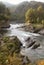 Landscape with fast seething river Chemal and rapids called Dragon Claws among the rocky shores covered with forests