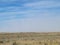 Landscape field clouds desert grass