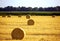 Landscape of field after harvest with bales