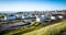 Landscape filled with petrol refinery tanks andequipment