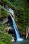 landscape flowing fresh cool blue water of waterfall in mountains