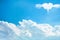 Landscape fluffy clouds group patterns and  heart shaped with wings concept floating on bright blue sky background , copy space