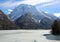 landscape of frozen little alpine lake