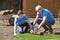 Landscape Gardeners Laying Turf For New Lawn