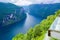 Landscape of Geirangerfjord and Seven Sisters Waterfall near small village of Geiranger. View from Eagles Road viewpoint. Norway