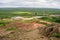 Landscape of Geysir with unrecognizable tourists in Iceland