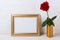 Landscape gold frame mockup with red rose in vase
