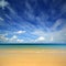 Landscape with gold sand beach and clouds