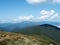 Landscape of grassland and mountain range at summer. Carpathians mountains in august, west Ukraine. Nature background