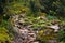Landscape of a green rock filled creek in Huascaran National Park