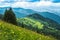 Landscape from height to mountain slopes, blue distance, meadow