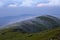 Landscape with high mountains. Amazing foggy summer morning. The early morning mist. A place to relax in the Carpathian Park,