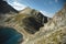 Landscape of highland lake high in the mountains of Dombai. Circus formed by a glacier with a deep lake and blue water