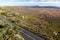 Landscape with highway snaking down into valley