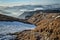 landscape of hiking paradise Schneeberg with snow field, rocks, hills, clouds, mist