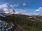 Landscape with hiking path leading through forest of coniferous trees at Parker Ridge in Banff National Park, Canada.