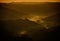 Landscape of hill silhouettes during a breathtaking sunset in the evening in Tuscany, Italy