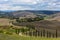 Landscape of hills, country road, cypresses trees and rural houses,Tuscany