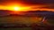 Landscape of hills covered in farm field crops during a breathtaking sunset in Tuscany, Italy