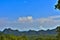 Landscape of Hills in the Forest with Trees Sky and Clouds in the Afternoon