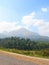 A Landscape with Hills, Trees, and a Roadside - Natural Background