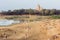 Landscape with Hindu temple of Khajuraho and children playing cricket, India