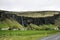Landscape houses Iceland green grass waterfall