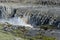 Landscape with huge Dettifoss waterfall with a rainbow, Iceland