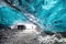 Landscape Ice Cave, with silhouette group of tourist and bright sunlight from cave entrance