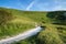 Landscape image of ancient chalk carving in hillside Long Man if