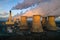 landscape image of Drax Power Station pumping steam and smoke from its chimney and cooling towers