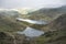 Landscape image of Glaslyn and Llyn Llydaw in Snowdonia with Glyder Fawr in the background with fog