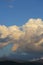 Landscape image, large cloud on sky above mountain hill