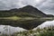 Landscape image of mountain reflected in still lake on Summer mo