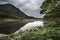 Landscape image of mountain reflected in still lake on Summer mo