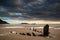 Landscape image of old shipwreck on beach at sunset in Summer