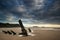 Landscape image of old shipwreck on beach at sunset in Summer