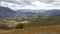 Landscape image of plain grass field and mountain