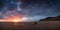 Landscape image of shipwreck on beach at Summer sunset