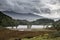 Landscape image of view from Precipice Walk in Snowdonia overlooking Barmouth and Coed-y-Brenin forest during rainy afternoon in