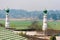 Landscape of Indian village in Assam with minarets of mosque and distant jungle